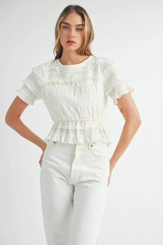 The Evelyn Smocked Ruffle Peplum Blouse