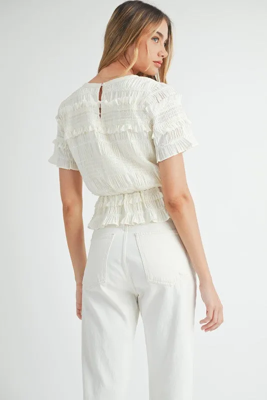 The Evelyn Smocked Ruffle Peplum Blouse